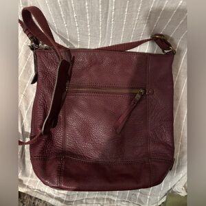 The Sak cross body purse in a deep red leather